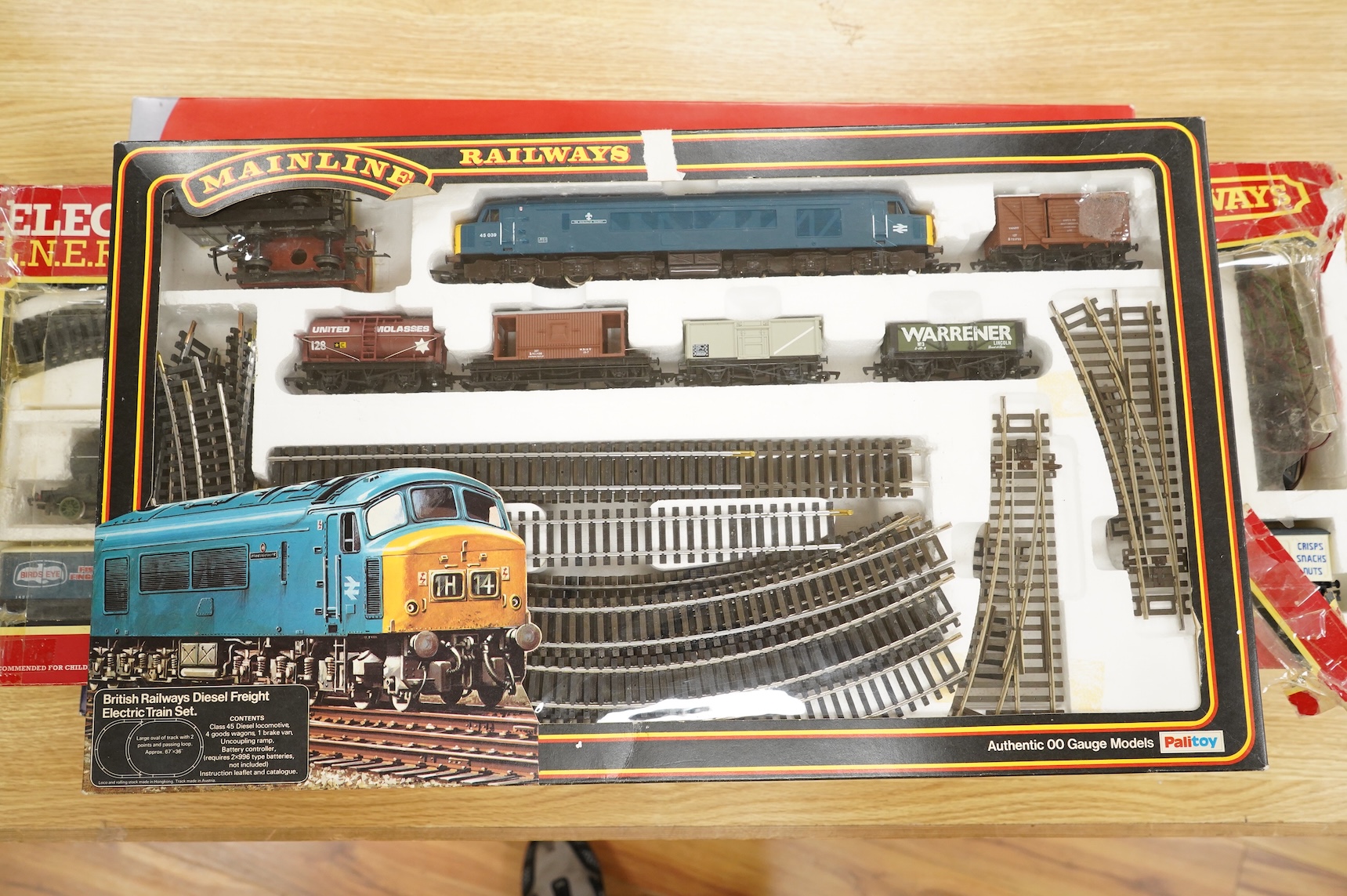 A collection of 00 gauge model railway, including three box train sets by Jouef, Mainline and Hornby, together with a large selection of unconstructed railway related plastic and metal kits and accessories, manufacturers